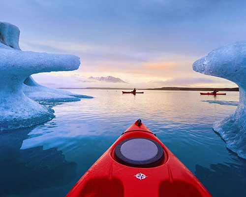 Four people inside a glacier in iceland.
